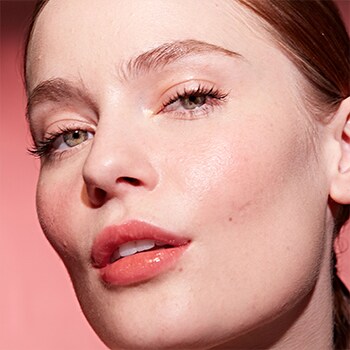 woman face wearing lipstick shade Bare Petal